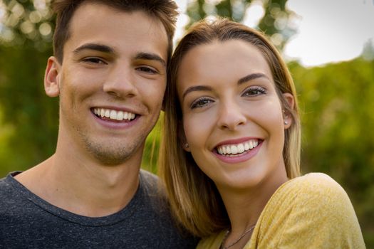 Portrait of a young beautiful couple smiling