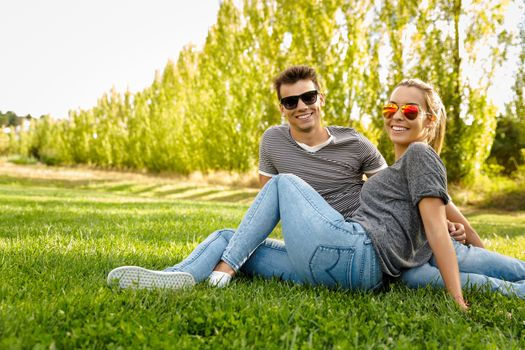 Portrait of a happy young couple enjoying a day in the park together