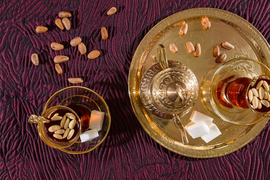 Tunisian tea in traditional glass seen from above