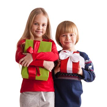 Portrait of two happy children with Christmas gift boxes isolated on white background