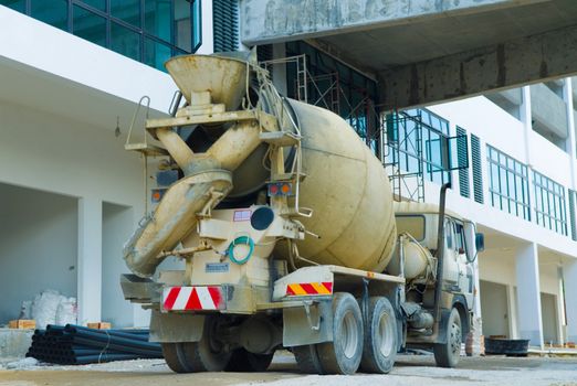 Mixer truck is transporting cement to the casting place on building site.