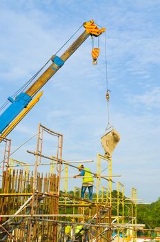 Construction site with crane and workers