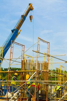 Construction site with crane and workers