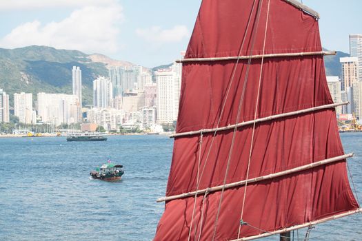 Chinese sailing ship in Hong Kong Victoria Habour at day