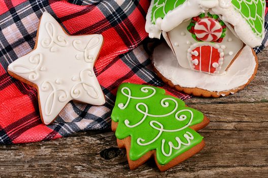 The gingerbread house on a wooden background