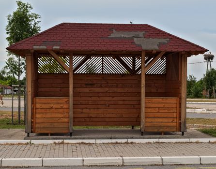 Wooden bus station at cloudy day