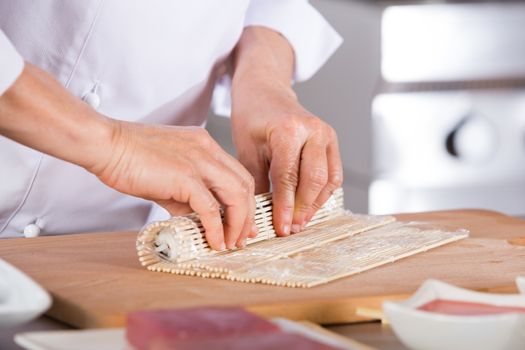 Chef preparing delicious sushi in a restaurant
