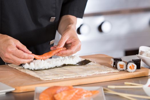 Chef preparing delicious sushi in a restaurant
