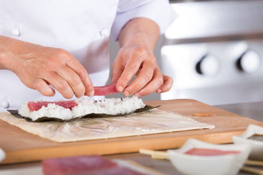 Chef preparing delicious sushi in a restaurant