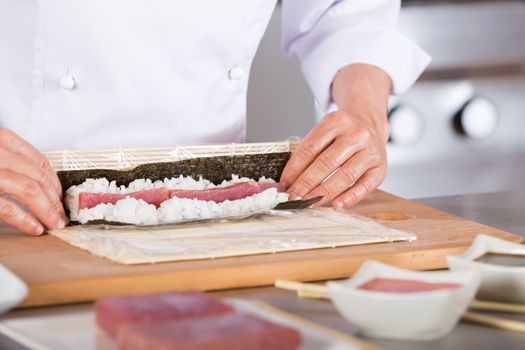 Chef preparing delicious sushi in a restaurant