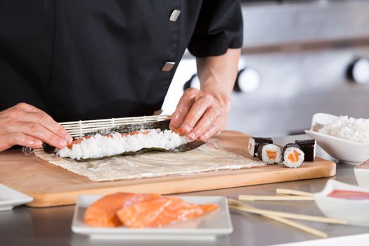 Chef preparing delicious sushi in a restaurant