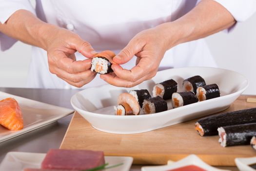 Chef preparing delicious sushi in a restaurant