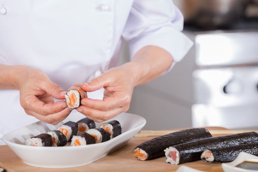 Chef preparing delicious sushi in a restaurant
