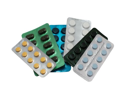 colorful assorted medicine pills on white isolated background