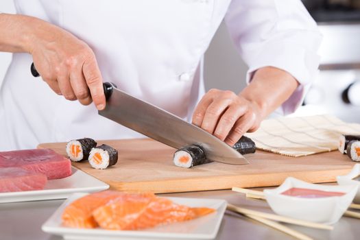 Chef preparing delicious sushi in a restaurant