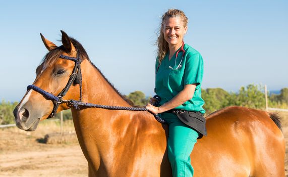 Equine veterinary at the equestrian riding a horse