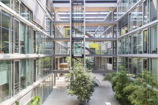 Main hall, staircase and windows of morden office building. Contemporary corporate business architecture.