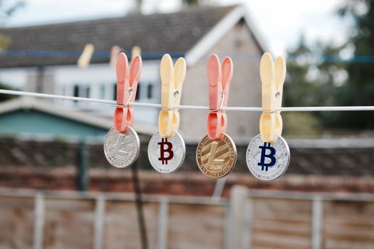 Digital currency physical silver and gold bitcoins and litecoins. Outdoor concept.