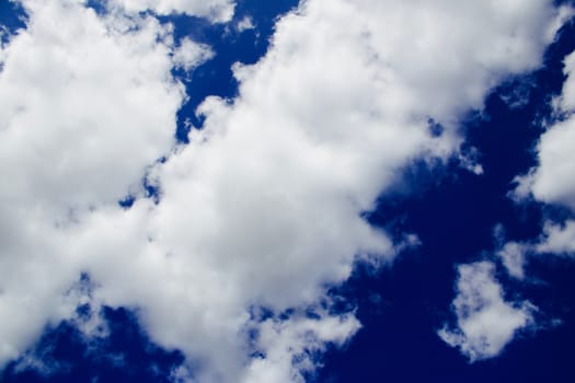 Blue sky with a white clouds. Sunny day outdoor concept.