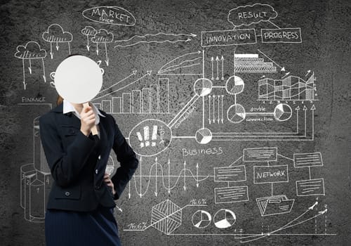 Businesswoman and graphs at background hiding her face behind mask