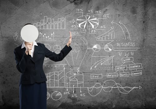 Businesswoman and graphs at background hiding her face behind mask