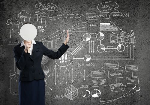 Businesswoman and graphs at background hiding her face behind mask