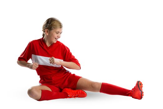 Teenager girl in red uniform isolated on white 
