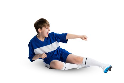 Boy football player in blue uniform against white background