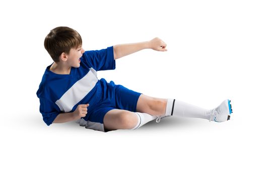 Boy football player in blue uniform against white background