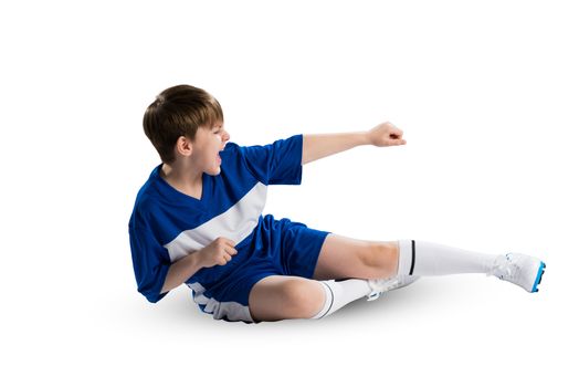 Boy football player in blue uniform against white background