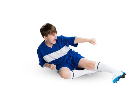 Boy football player in blue uniform against white background