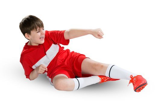 Boy football player in red uniform against white background