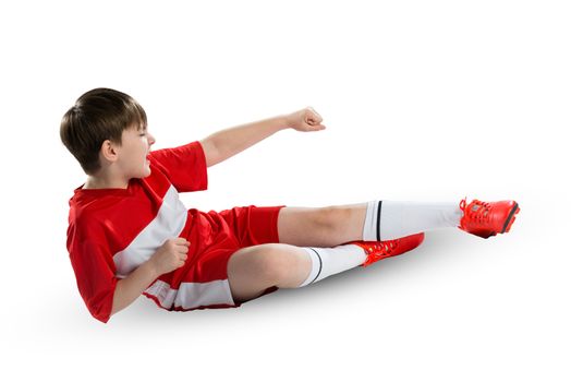 Boy football player in red uniform against white background