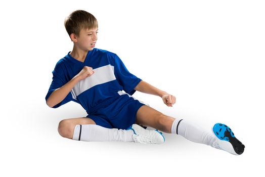 Boy football player in blue uniform against white background