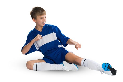 Boy football player in blue uniform against white background