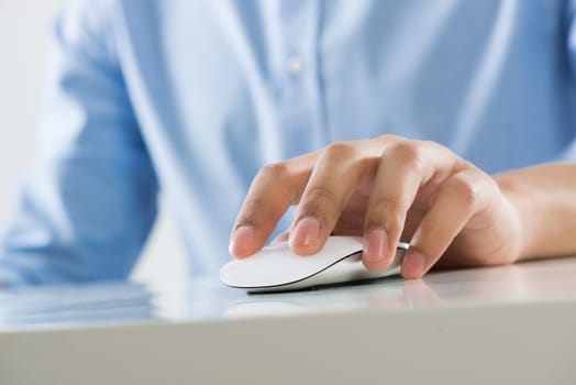 Young man sitting at desk and working on computer