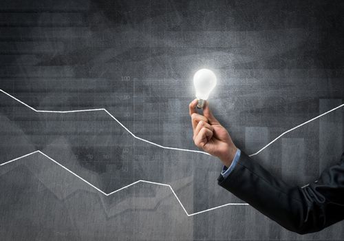Conceptual image with light bulb diagrams and graphs
