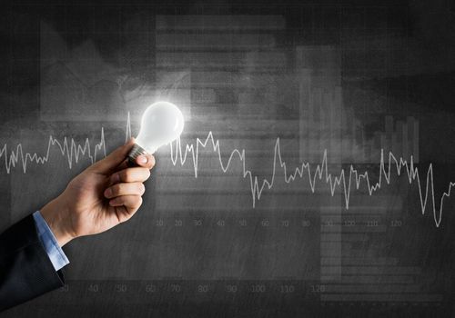 Conceptual image with light bulb diagrams and graphs