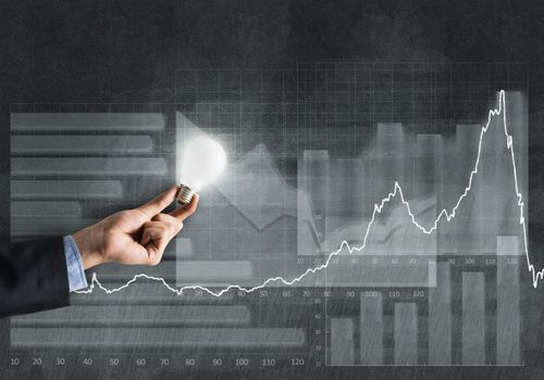 Conceptual image with light bulb diagrams and graphs
