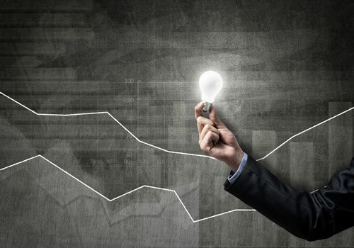 Conceptual image with light bulb diagrams and graphs