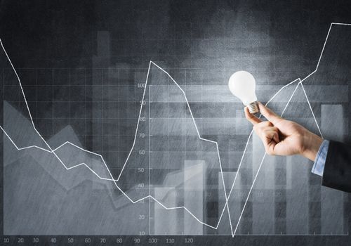 Conceptual image with light bulb diagrams and graphs