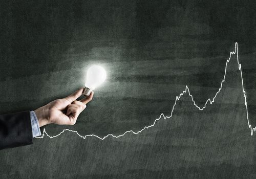 Conceptual image with light bulb diagrams and graphs