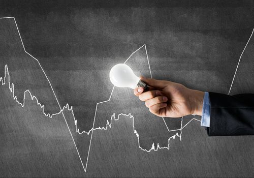 Conceptual image with light bulb diagrams and graphs