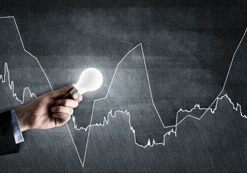 Conceptual image with light bulb diagrams and graphs
