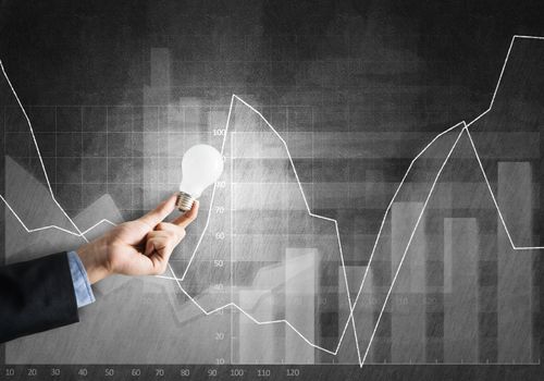 Conceptual image with light bulb diagrams and graphs