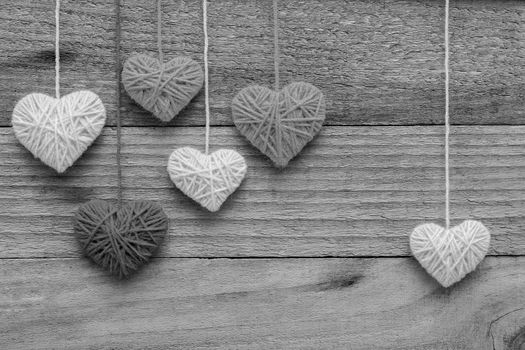 heart shape made from knitting wool on old shabby wooden background, Image of Valentine's day