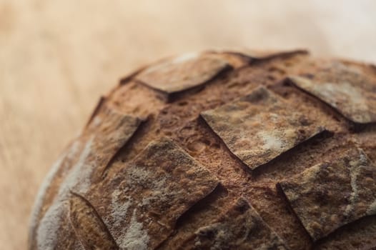 Close-up of artisan bread on wooden background