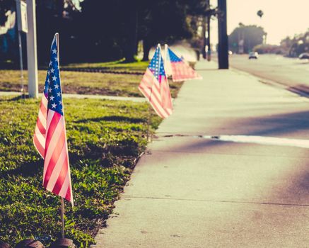 Retro Style Image Of An American Flag On A Lawn