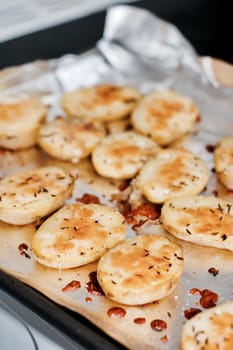 Fresh and tasty baked potatoes in the kitchen. Natural food concept.