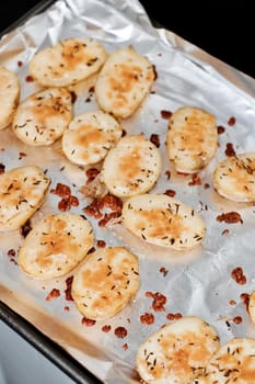 Fresh and tasty baked potatoes in the kitchen. Natural food concept.